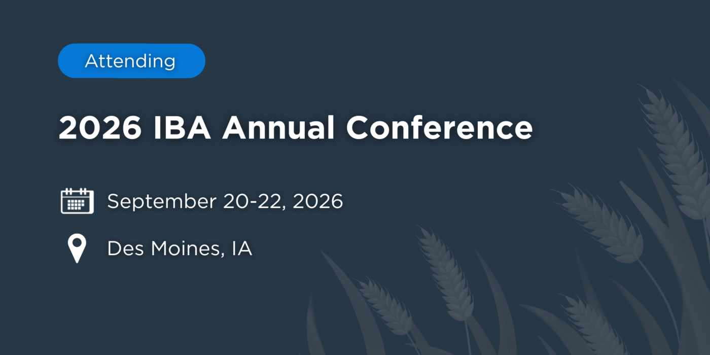 Graphic displaying “Attending 2026 IBA Annual Conference” with event details listed as September 20–22, 2026 in Des Moines, Iowa, on a dark blue background featuring wheat illustrations on the right side.